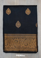 Black fabric with gold embroidery and 'PREMJoy' branding on a gray background