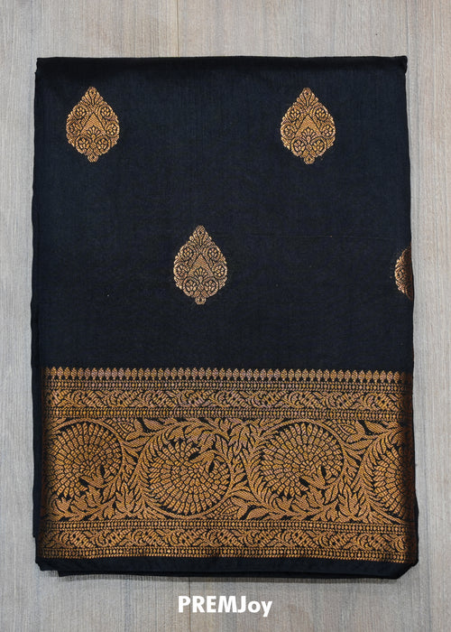 Black fabric with gold embroidery and 'PREMJoy' branding on a gray background