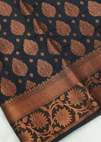 Black fabric with brown floral patterns on a white background